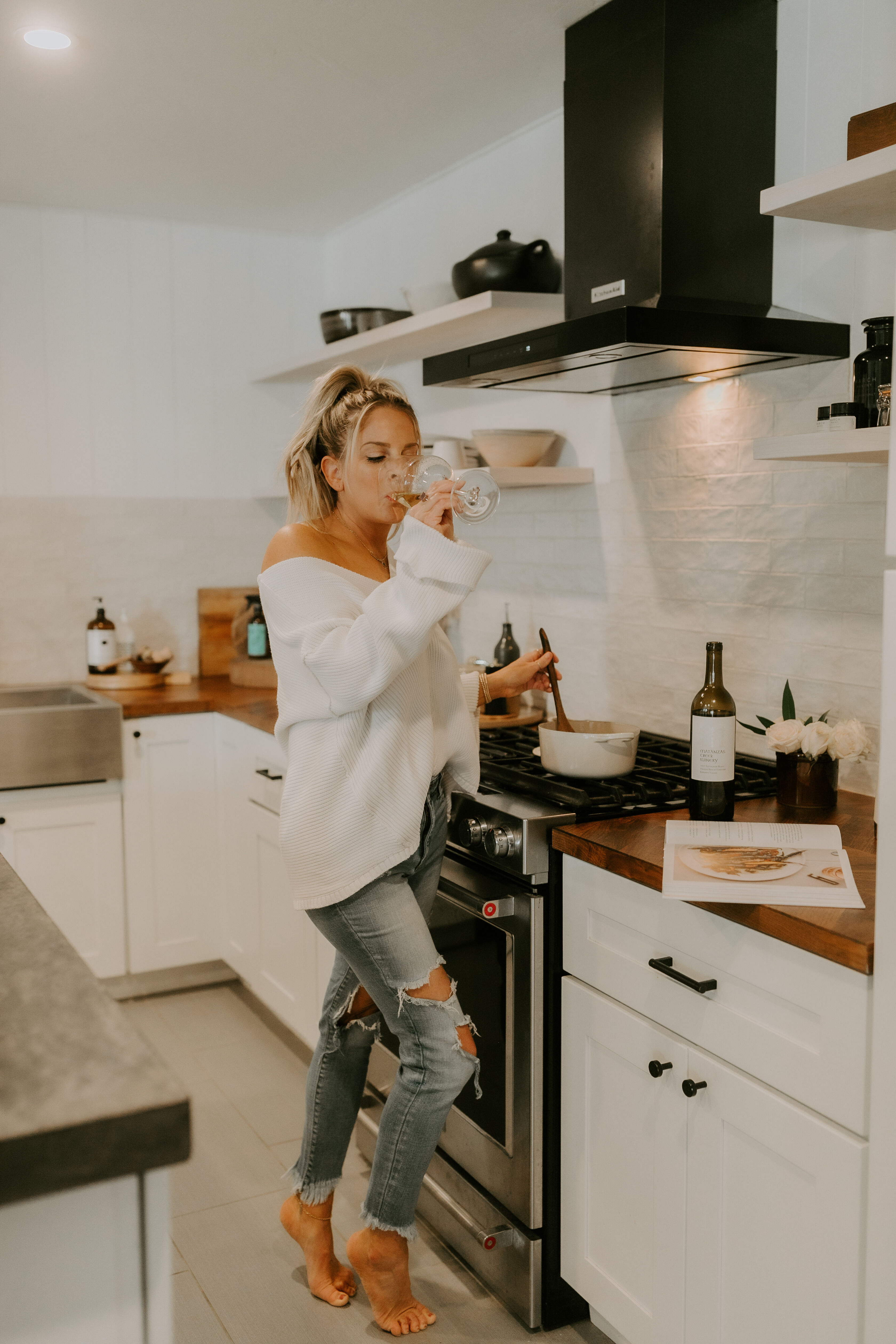 Erika in the kitchen cooking with wine